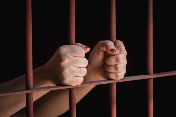 depositphotos_102279166-stock-photo-woman-hand-in-jail