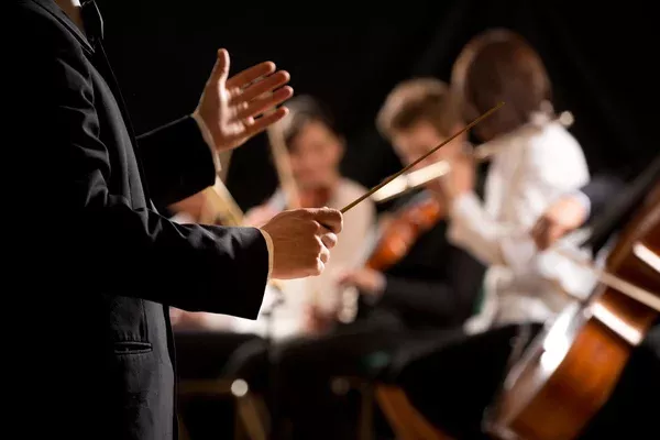 depositphotos_47573953-stock-photo-orchestra-conductor-on-stage