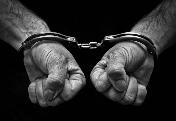 depositphotos_130406914-stock-photo-man-cuffed-and-doomed