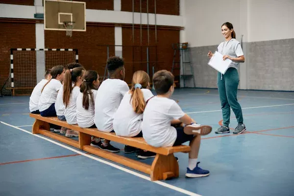 depositphotos_589430414-stock-photo-young-female-coach-having-pe