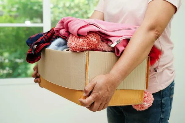 clothes-donations-in-cardboard-box-for-volunteer-photo
